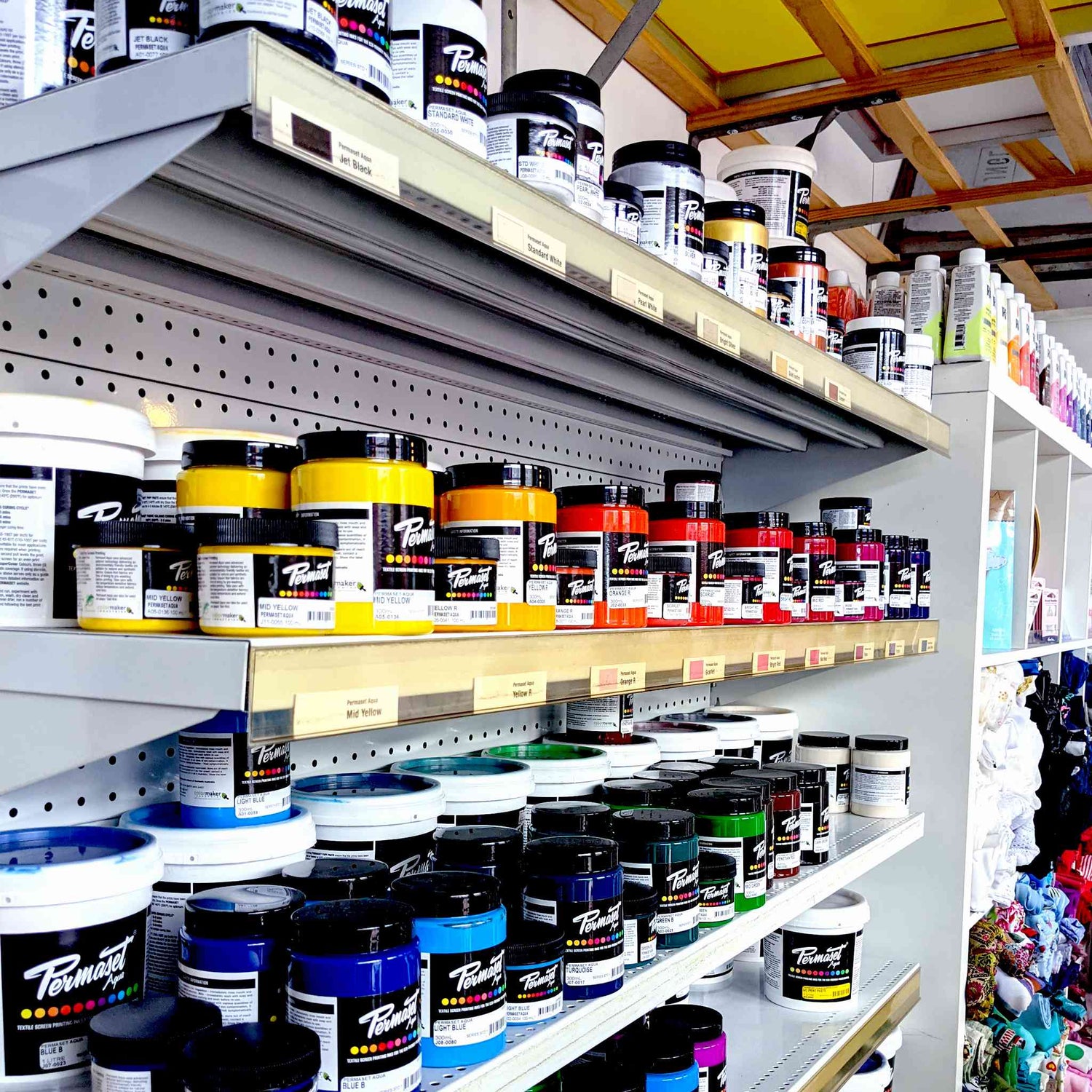 Bobbin and Ink Permaset Aqua ink shelf tubs for sale with Rit Dye in the background