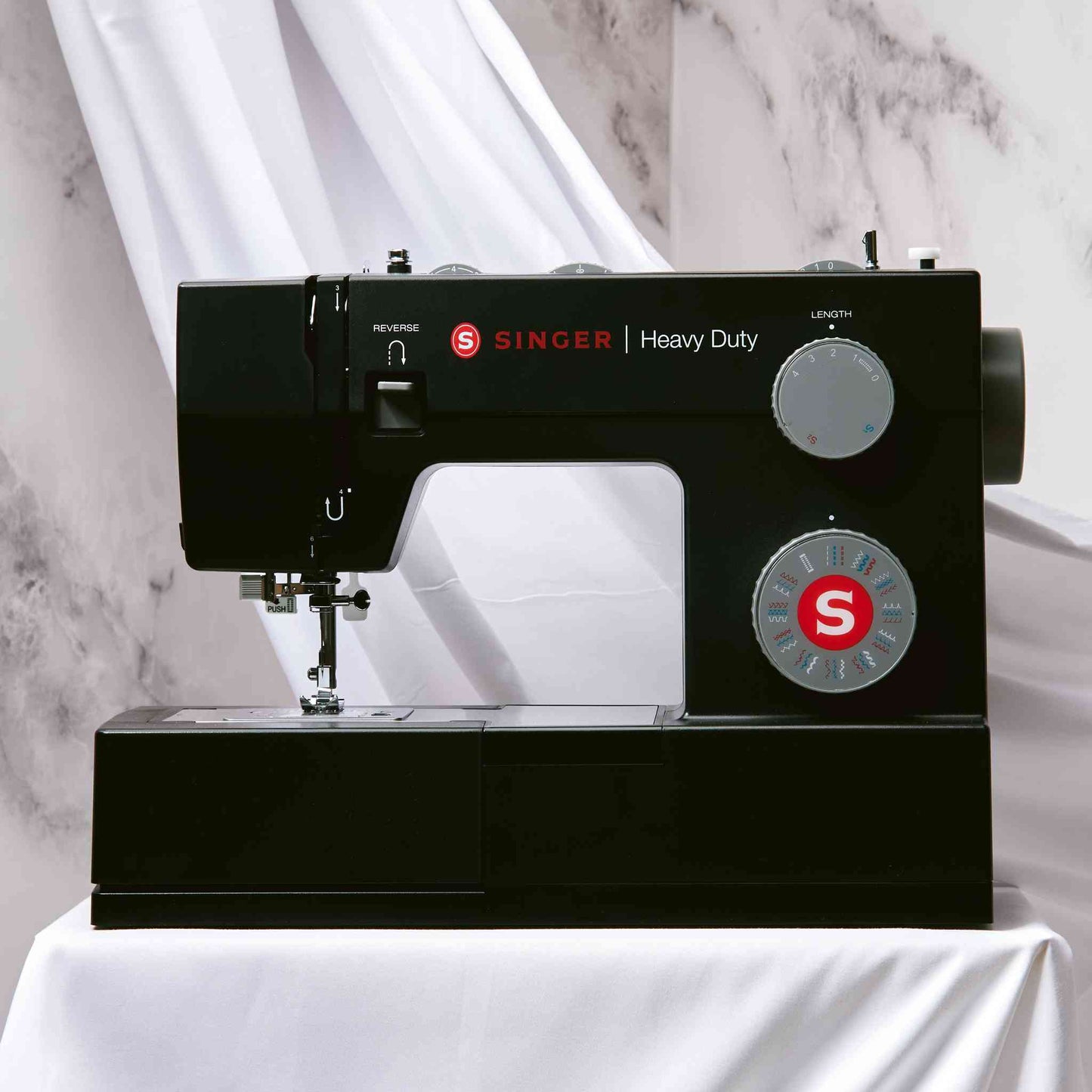 Singer 4432 sewing machine in black shown with white background and front view