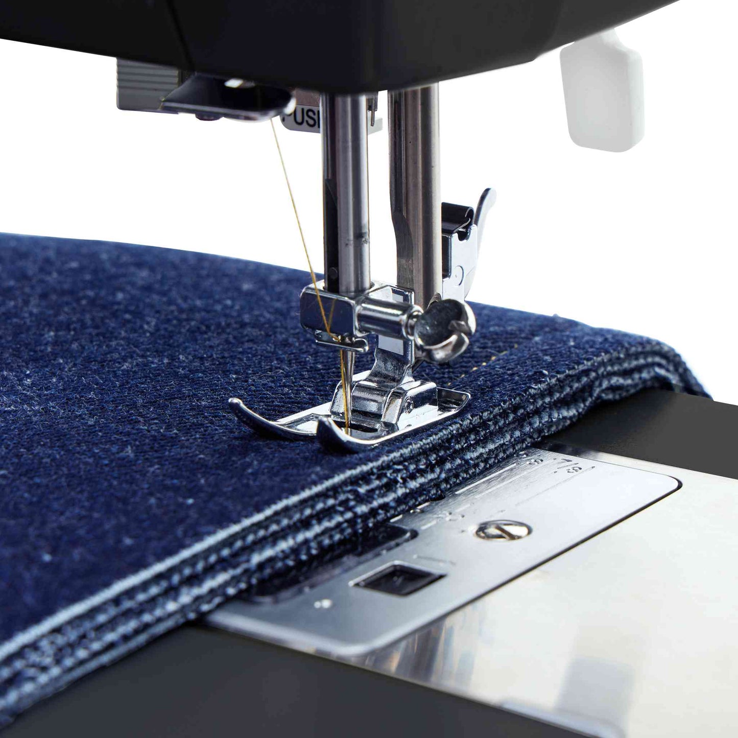 Singer 4432 sewing machine in black showing needle sewing denim