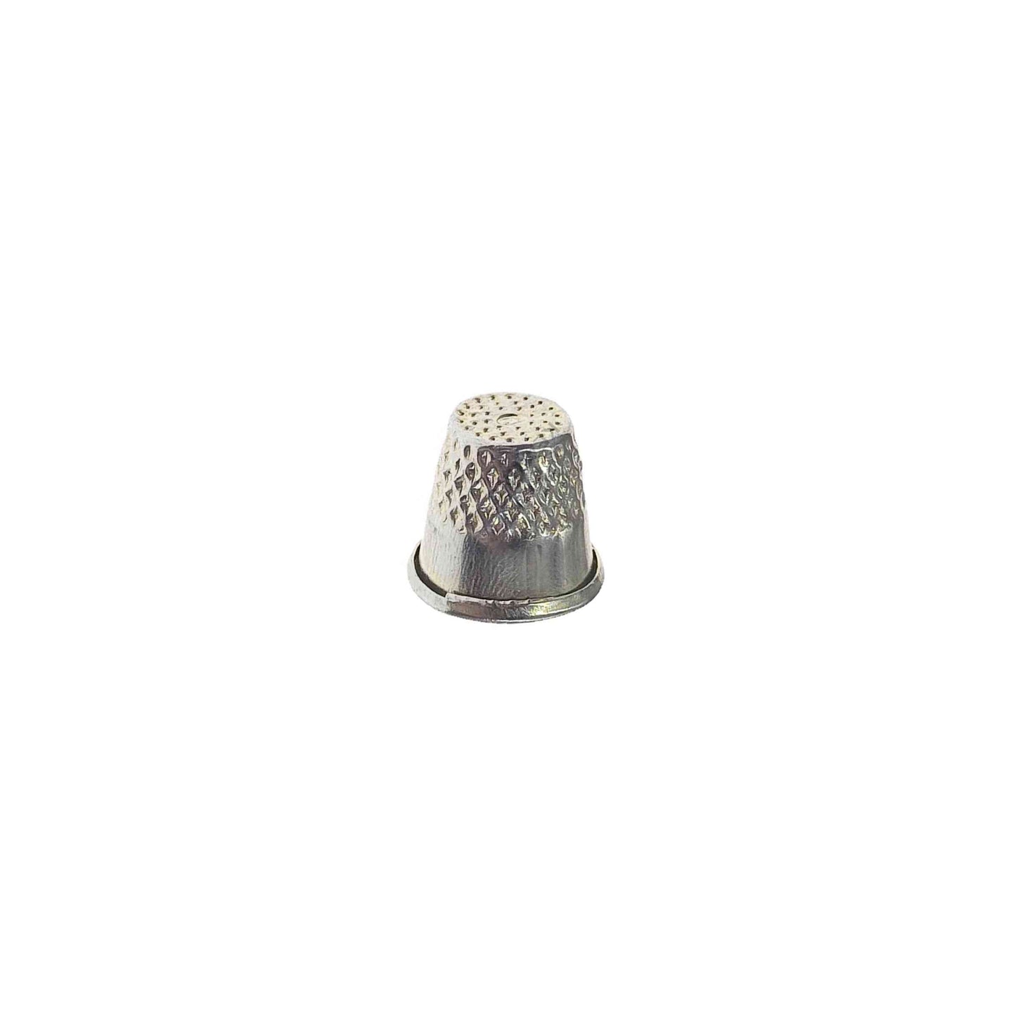Metal alloy cap sewing thimble on white background