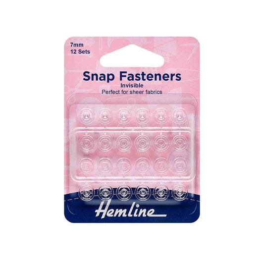 12 set packet of Hemline invisible snap fasteners to sew into garments. 7mm wide, clear plastic.